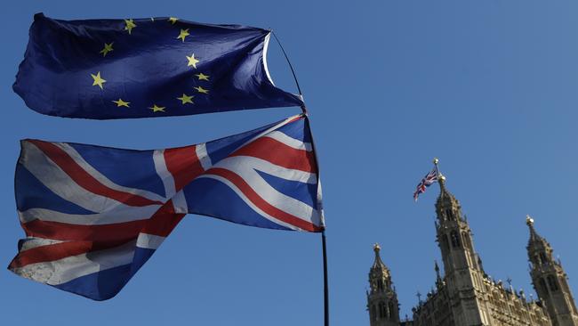 The flag of the European Union and the British national flags are flown on poles during a demonstration by remain in the EU outside spporters the Palace of Westminster in London. Photo: AP/Alastair Grant