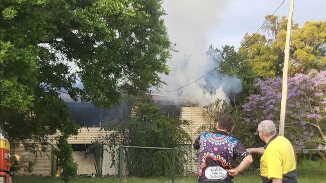 Locals watch on as firefighters blame the house fire in Murgon on Monday, October 21. Photo: Deb Chafer