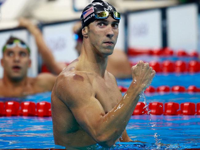 RIO DE JANEIRO, BRAZIL - AUGUST 09: Michael Phelps of the United States celebrates winning gold in the Men's 200m Butterfly Final on Day 4 of the Rio 2016 Olympic Games at the Olympic Aquatics Stadium on August 9, 2016 in Rio de Janeiro, Brazil. (Photo by Adam Pretty/Getty Images)