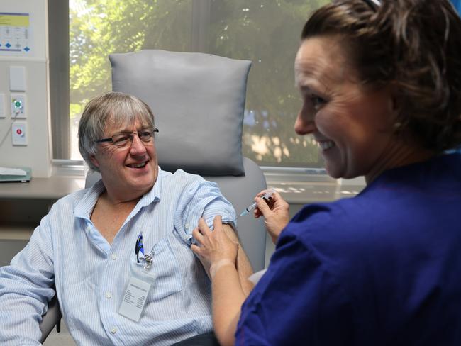 Dr Peter Rischbieth, President of Rural Doctors Association of SA is given the AstraZeneca injection by nurse Maria Reich.