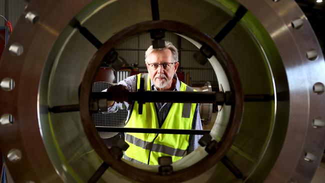 Wellsun Engineering managing director Shaun Hall at his Lonsdale workshop with some of the steel piping that will be used in Santos's carbon capture and storage project at Moomba. Picture: NCA NewsWire / Kelly Barnes