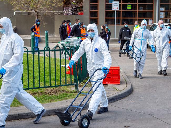 Residents receive supplies during the public housing lockdown. Picture: Jake Nowakowski