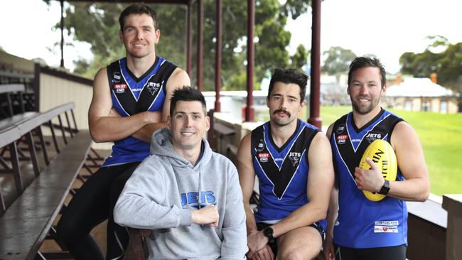 Unley Mercedes coach Kane Stewart with players Blake Harris, Anthont Skara and Daniel Caire. Picture: AAP/Dean Martin