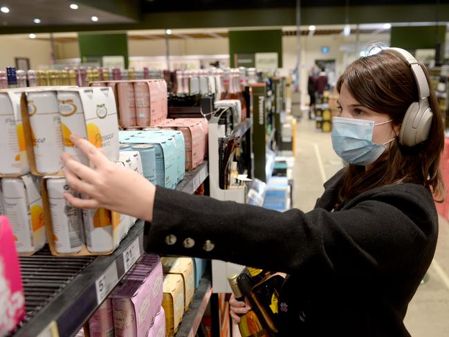 SYDNEY, AUSTRALIA - NewsWire Photos JULY 31. A shopper browses the aisles at Dan Murphy's in Alexandria  as the Woolworths Group begins encouraging shoppers to wear masks throughout their stores, Friday, July 31, 2020.Picture: NCA NewsWire / Jeremy Piper