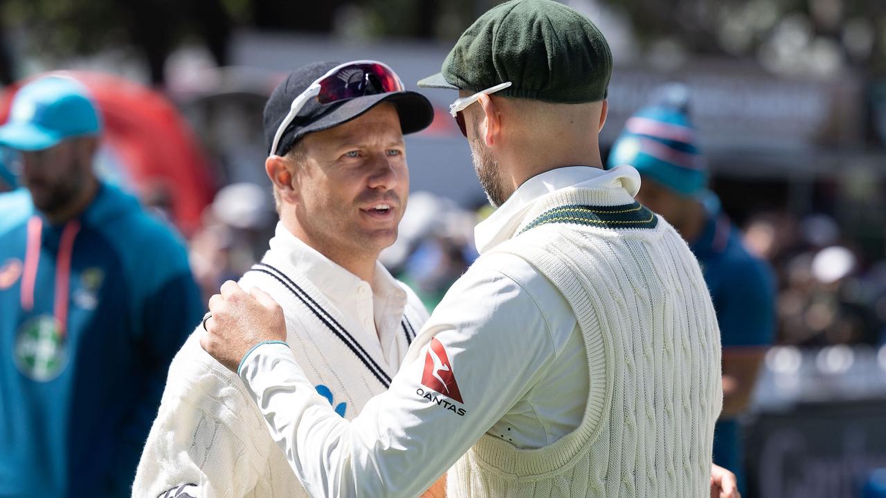 New Zealand’s Neil Wagner speaks with Australia's Nathan Lyon. Photo by Marty MELVILLE / AFP