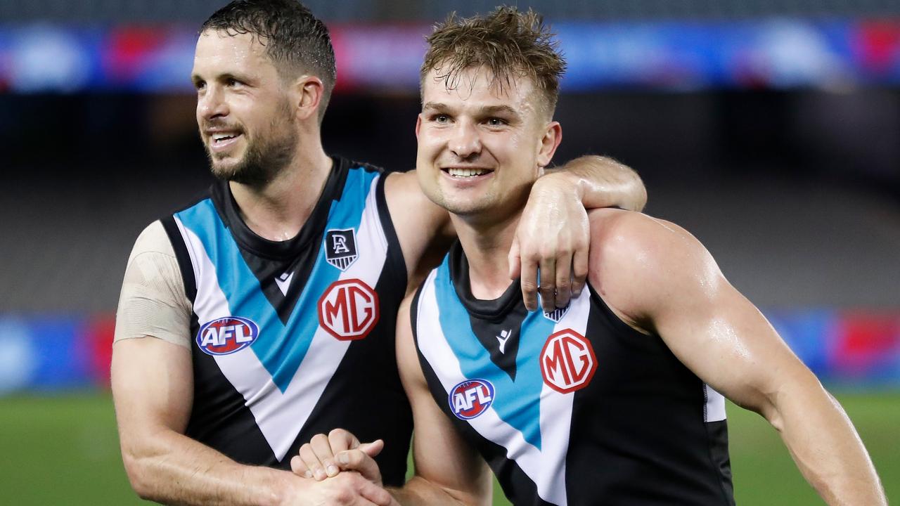 Port Adelaide players Travis Boak and Ollie Wines have urged the state government to increase capacity for AFL finals at Adelaide Oval. Picture: Michael Willson/AFL Photos via Getty Images