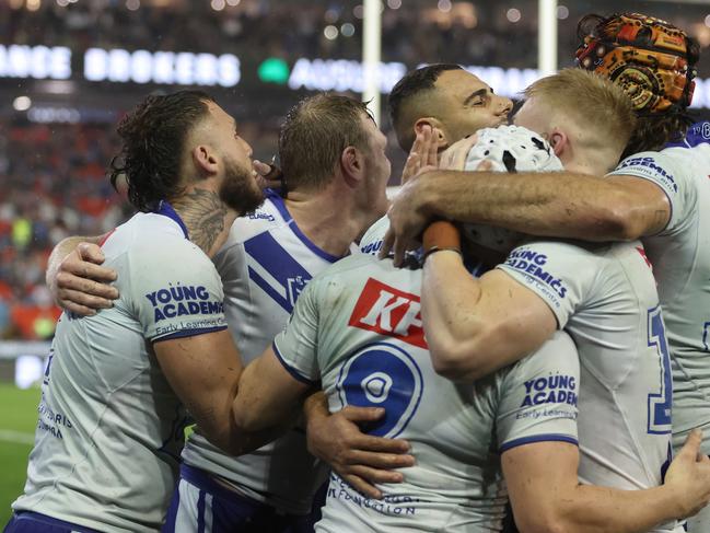 The Bulldogs celebrate their victory over Newcastle. Picture: Scott Gardiner/Getty Images