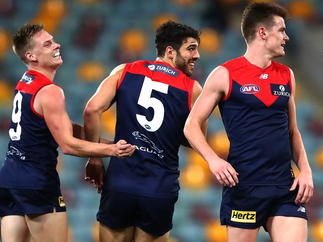 Christian Petracca celebrates a goal as the Dees enjoyed a night out against the Magpies.