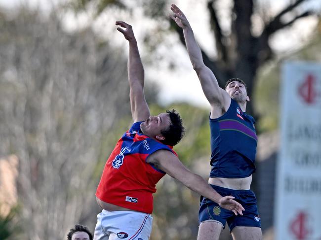 Mernda’s Billy Morrison jumps against Sam Gilmore of Old Paradians. Picture: Andy Brownbill