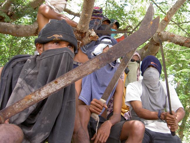 Members of one of Port Moresby’s feared Raskol gangs that have contributed to the city’s poor international reputation. Picture: Rory Callinan