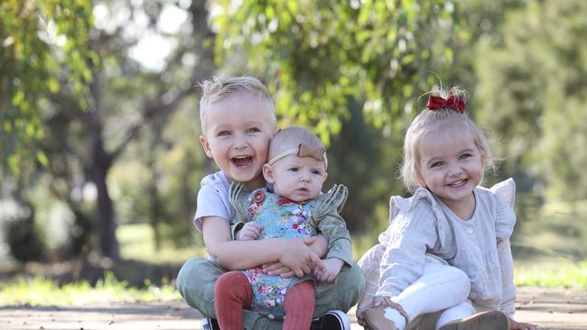 Kristy-Lee Williams and her kids Levi, 3, and Ellie, 2, and Nora, 12 weeks, are part of Kids Party Rescue which is a group of families that open their homes for kids to join parties. Picture: David Swift.