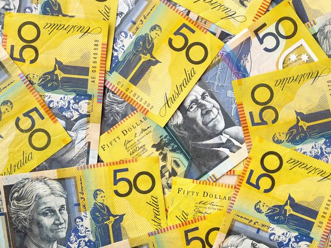 Background of Australian fifty dollar bills.  Full-frame. generic money, notes, cash.