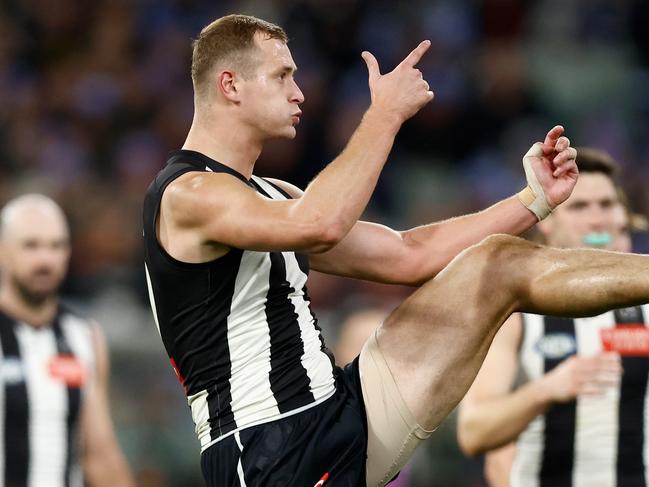 MELBOURNE, AUSTRALIA – JUNE 10: Nathan Kreuger of the Magpies kicks a goal during the 2024 AFL Round 13 match between the Collingwood Magpies and the Melbourne Demons at The Melbourne Cricket Ground on June 10, 2024 in Melbourne, Australia. (Photo by Michael Willson/AFL Photos via Getty Images)