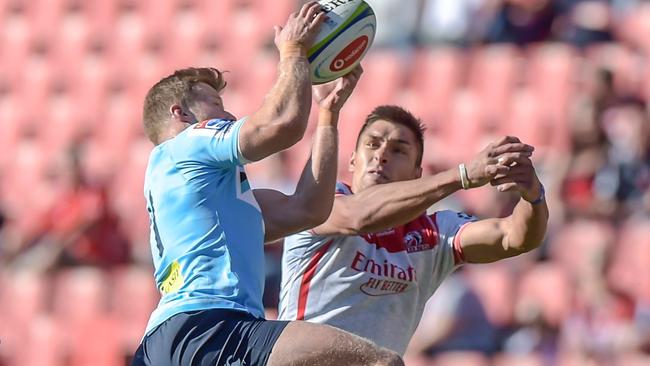 The NSW Waratah's Alex Newsome (C-L) and The Emirates Lions' Harold Vorster (C-R) jump for the ball during the Super XV Rugby Union match between Emirates Lions and NSW Waratahs at Emirates Airline Park, in Johannesburg, on 11 May, 2019. (Photo by Christiaan Kotze / AFP)