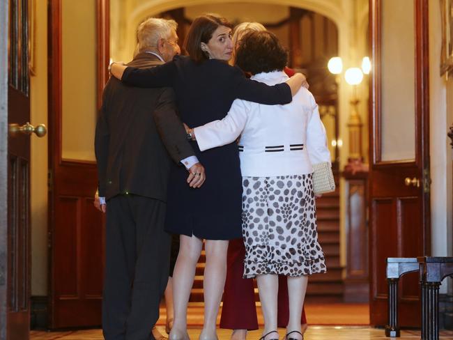 Gladys Berejiklian embraces her parents after her swearing-in ceremony at Government House. Picture: Toby Zerna