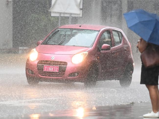 BRISBANE, AUSTRALIA - NewsWire Photos - FEBRUARY 2, 2021.People make their way through heavy rain in central Brisbane. A severe thunderstorm warning with possible flash flooding has been issued for the southeast, including Brisbane CBD, as wet weather causes traffic chaos on Tuesday morning.Picture: NCA NewsWire / Dan Peled