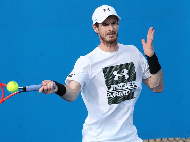 Andy Murray tentative on his right foot during his practice session with Milos Raonic which was cut short due to rain, Brisbane International Tennis. Photographer: Liam Kidston.