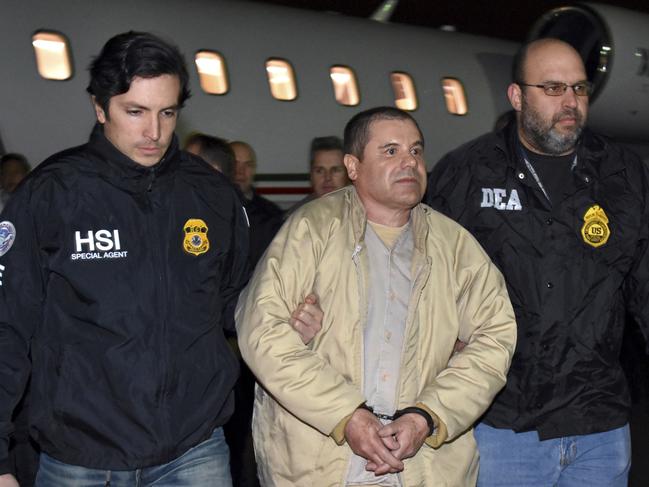 In this January 19, 2017, file photo provided by U.S. law enforcement, authorities escort Joaquin "El Chapo" Guzman, to jail. Picture: AP