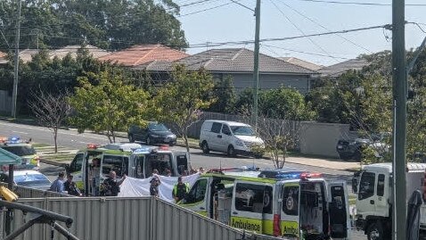 Paramedics treat a teenage boy hit by a car on Browns Plains Rd last week.