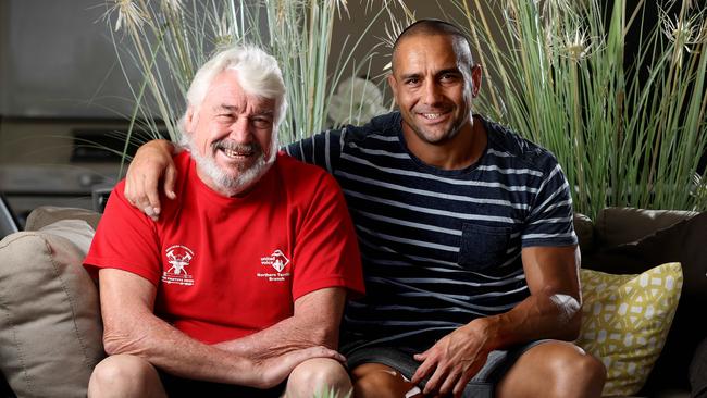 Retired Darwin firefighter Jock McLeod with his son Andrew, a former Adelaide Crows footballer. Jock won a landmark compensation claim in 2017 for contracting cancer as a result of his line of work. Photo: Calum Robertson