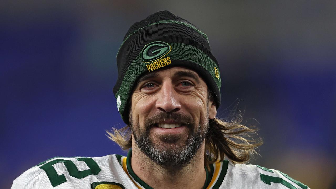 BALTIMORE, MARYLAND - DECEMBER 19: Aaron Rodgers #12 of the Green Bay Packers smiles as he walks off the field after their game against the Baltimore Ravens at M&amp;T Bank Stadium on December 19, 2021 in Baltimore, Maryland. Patrick Smith/Getty Images/AFP == FOR NEWSPAPERS, INTERNET, TELCOS &amp; TELEVISION USE ONLY ==