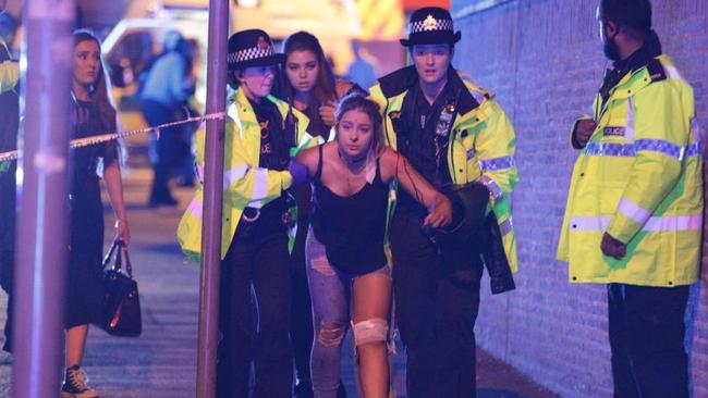 Police and other emergency services are seen near the Manchester Arena after reports of an explosion. Photo: Joel Goodman/LNP