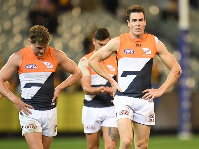 Jeremy Cameron of the Giants (centre) reacts after the Round 8 AFL match between the Hawthorn Hawks and the GWS Giants at the MCG in Melbourne, Sunday, May 12, 2019.  (AAP Image/Julian Smith) NO ARCHIVING, EDITORIAL USE ONLY