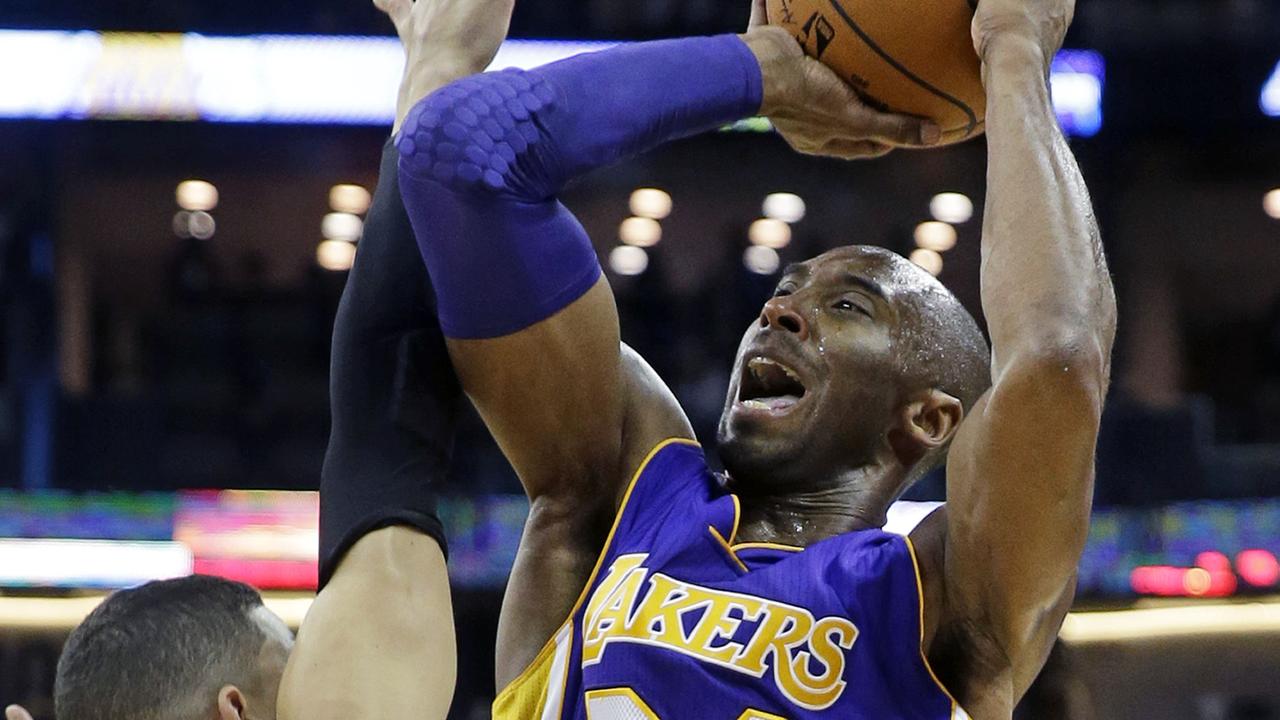 Los Angeles Lakers guard Kobe Bryant (24) shoots over New Orleans Pelicans guard Austin Rivers (25) during the first half of an NBA basketball game in New Orleans, Wednesday, Nov. 12, 2014. (AP Photo/Gerald Herbert)