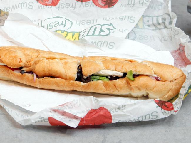 FILE - This Aug. 11, 2009, file photo, shows a chicken breast sandwich and water from Subway on a kitchen counter in New York. Subway says an ingredient dubbed the 
