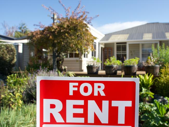 A For Rent Sign Outside a House.