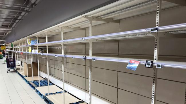 The rug of normality has been pulled from under us, inevitably resulting in anxiety. Empty shelves in a supermarket have become commonplace amid the coronavirus crisis. Picture: AFP