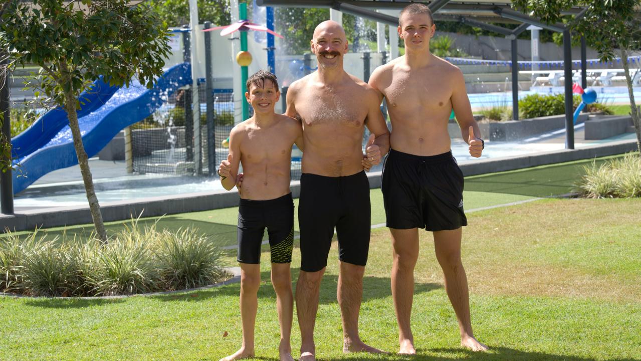 Kenton Webb, with his sons and cheering squad, Jonathan (13) and Ryan (16) at Gympie Aquatic and Recreational Centre. Picture: Christine Schindler