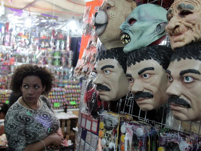 His appetite for revenge has for decades been folklore in Mexico, with costume shops even selling masks of the drug trafficker. Picture: AAP