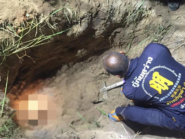 Thai police examine the shallow grave where the body of Hells Angels bikie Wayne Schneider was found at Chon Buri, Thailand in 2015.