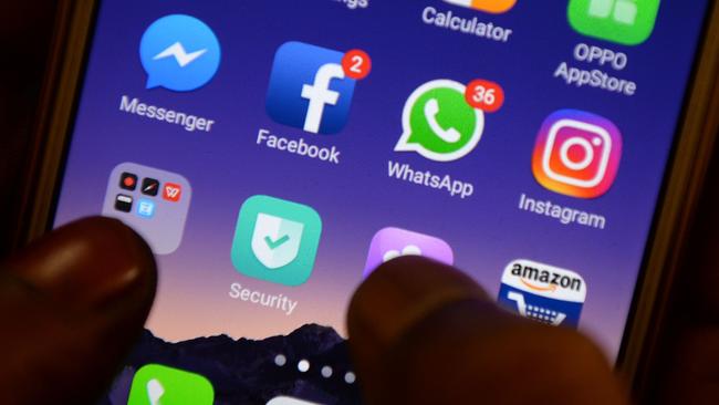 The latest hack sees attackers infiltrate WhatsApp message threads and impersonate users to spread fake news. Picture: AFP/Arun Sankar