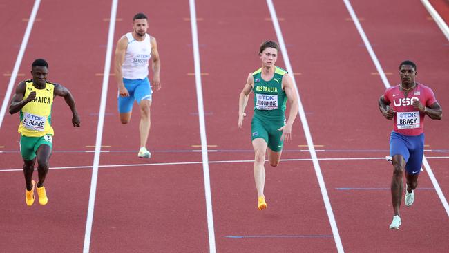 EUGENE, OREGON - JULY 15: Ackeem Blake of Team Jamaica, Francesco Sansovini of Team San Marino, Rohan Browning of Team Australia and Marvin Bracy of Team United States looks on after competing in the Men's 100 Meter heats on day one of the World Athletics Championships Oregon22 at Hayward Field on July 15, 2022 in Eugene, Oregon. (Photo by Ezra Shaw/Getty Images)