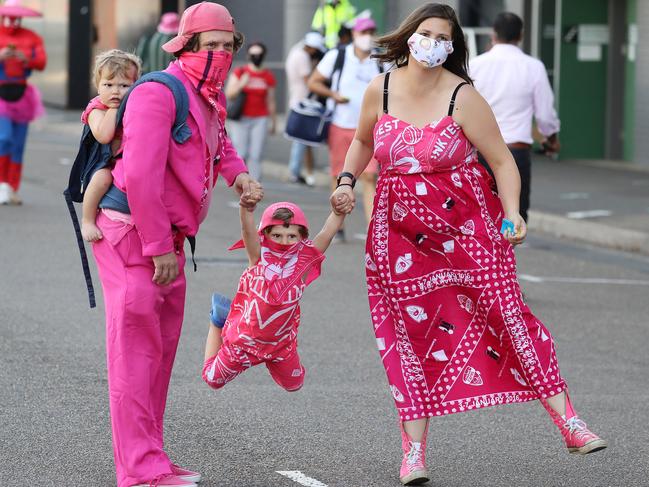 The McAlpin family — Tim and Claire plus John, 4, and Theo, 1, fully embraced the pink theme. Picture: Tim Hunter