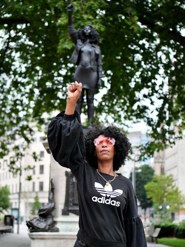 Black Lives Matter protester Jen Reid with the sculpture of herself, by local artist Marc Quinn, on the plinth where the Edward Colston statue used to stand. Picture: Getty Images