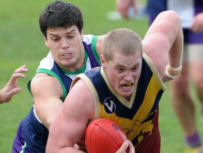 VAFA Football: NOBS-St Pats V Therry Penola. Nobs no 24 Rex Gravan tackles Therry Penola no 13 Darcy Grant