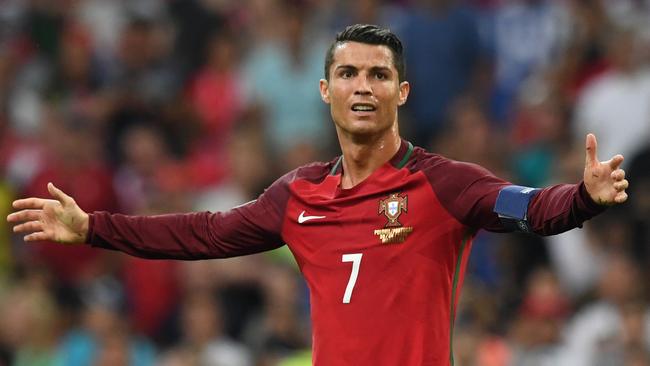 Portugal's Cristiano Ronaldo barely avoided a pitch invader during their match with Poland.