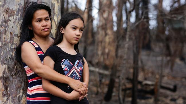 Josie Smith with daughter Emerald lost their husband and father John as a bushfire ripped through their Catalina home on New Year’s Eve. Picture: Gaye Gerard