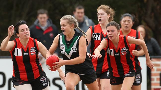 Donvale’s Jess Crundall breaks away from Blackburn pressure  Picture: Hamish Blair