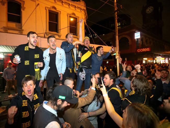 Tigers supporters celebrating along Swan St. Picture: AAP/James Ross