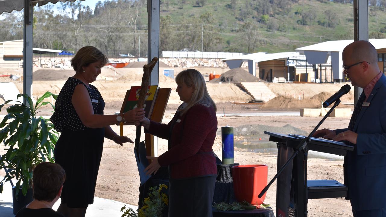 Sophia College Principal, Narelle Dobson receives the shovel that was made with timber taken from the site