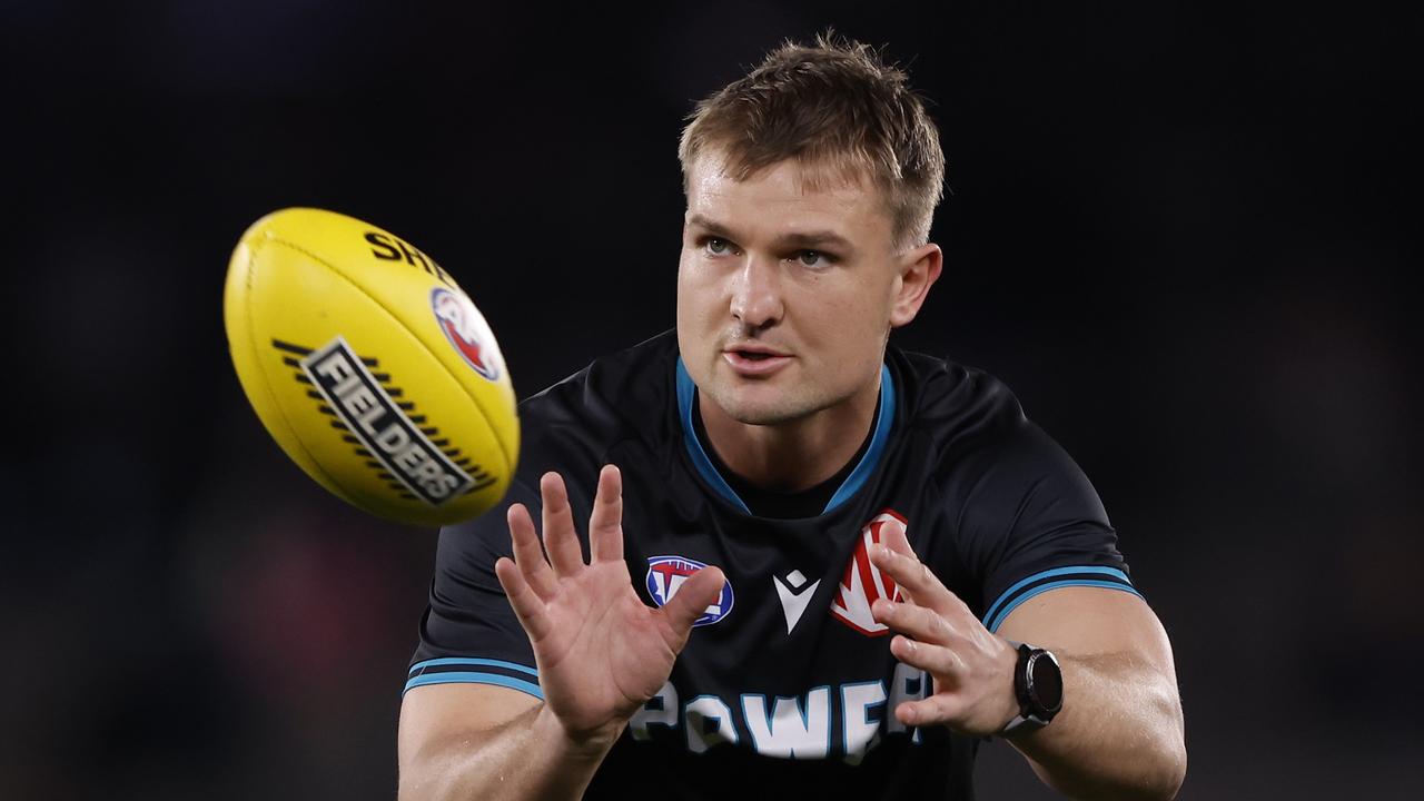 MELBOURNE, AUSTRALIA – JULY 26: Ollie Wines of the Power warms up before during the round 20AFL match between Carlton Blues and Port Adelaide Power at Marvel Stadium, on July 26, 2024, in Melbourne, Australia. (Photo by Darrian Traynor/Getty Images)