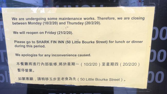 The sign on the Shark Fin House door.