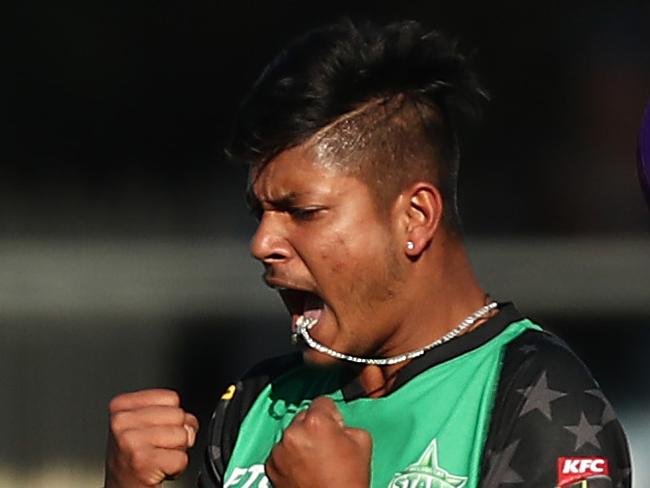 HOBART, AUSTRALIA - DECEMBER 24: Sandeep Lamichhane of the Stars celebrates taking the wicket of Ben McDermott of the Hurricanes during Hobart Hurricanes v Melbourne Stars Big Bash League Match at Blundstone Arena on December 24, 2018 in Hobart, Australia. (Photo by Mark Metcalfe/Getty Images) *** BESTPIX ***