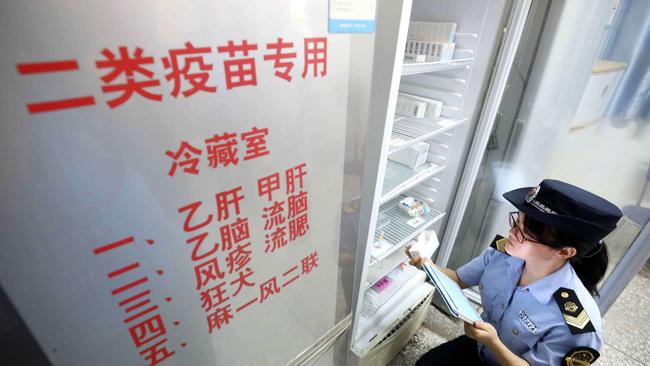 A Food and Drug Administration officer checks on vaccines at a hospital in Rongan in China's southern Guangxi region. Picture: AFP