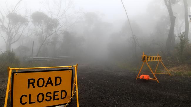 Thick fog mixed with bushfire smoke fills the sky near the Ruined Castle fire on January 11. Picture: Saeed Khan/AFP