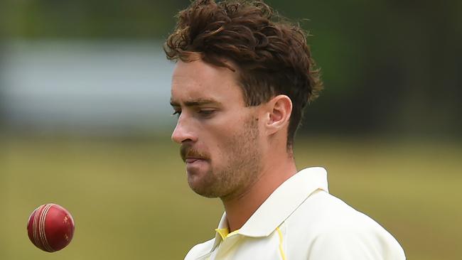 BRISBANE, AUSTRALIA - DECEMBER 09: Jordan Buckingham of Australia tosses the ball before bowling during day one of the Tour Match between Australia A and South Africa at Allan Border Field on December 09, 2022 in Brisbane, Australia. (Photo by Albert Perez/Getty Images)